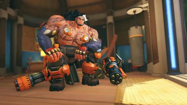 Mauga smiles with his miniguns